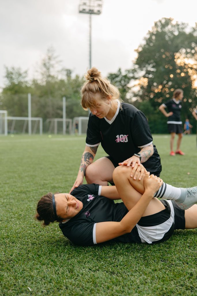Player holding his ankle after an injury