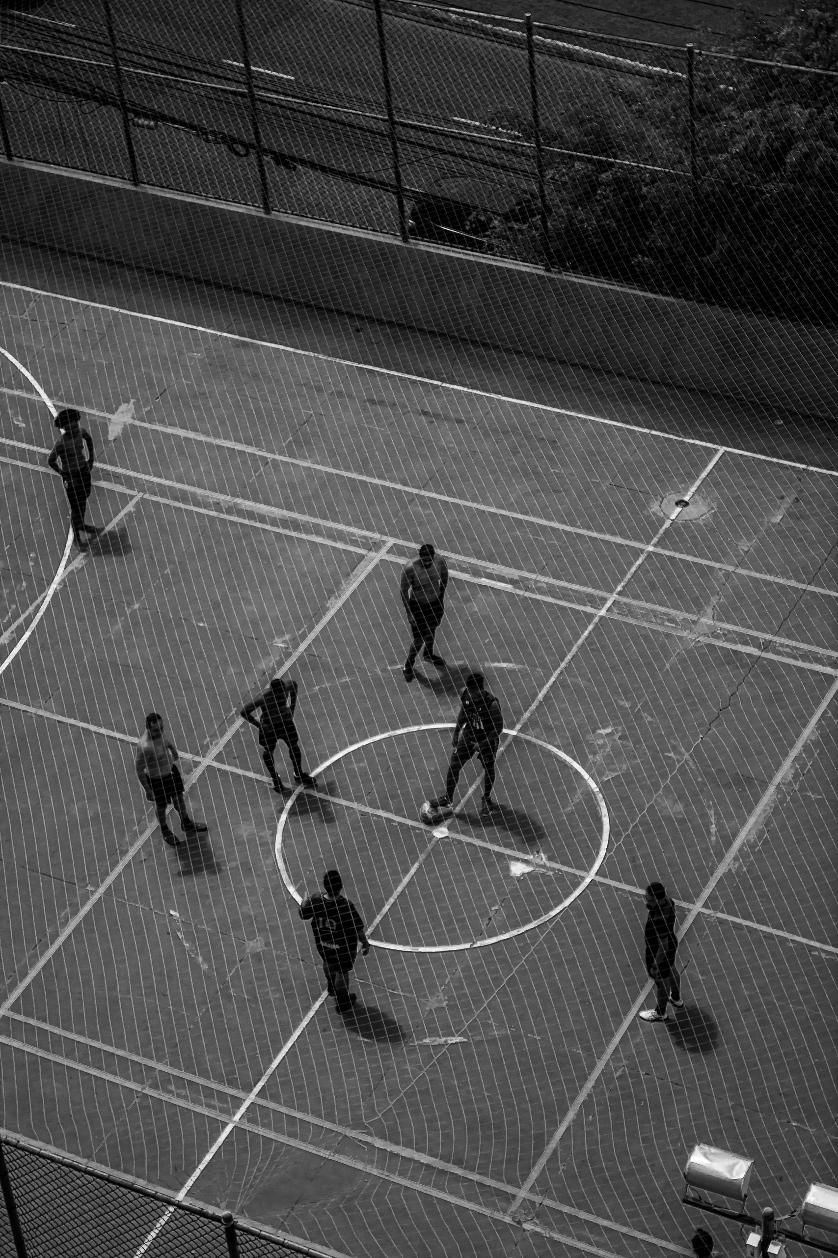 Amateur footballers on an outdoor pitch